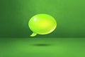 Green speech bubble on concrete wall background Royalty Free Stock Photo