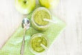 Green Spinach Fruit And Vegetable Smoothies With Apples and Spoon