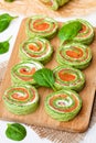 Green spinach roll with smoked salted salmon and cream cheese Royalty Free Stock Photo