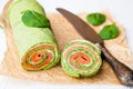 Green spinach roll with smoked salted salmon and cream cheese Royalty Free Stock Photo