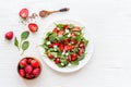 Green spinach salad with red strawberry and goat cheese, top view Royalty Free Stock Photo