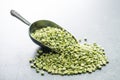 Green split peas in metal scoop. Royalty Free Stock Photo