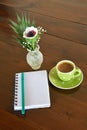 Green spotty mug and note pad Royalty Free Stock Photo