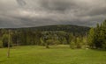 Green spring meadow near Bedrichov village in Jizerske mountains Royalty Free Stock Photo