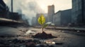 A green sprout against a blurred cityscape. The concept of nature, the struggle for life in a polluted environment Royalty Free Stock Photo