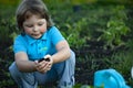 Green Sprout and Children Hands