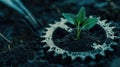 A green sprout grows from soil within a metallic gear, symbolizing eco-friendly innovation Royalty Free Stock Photo
