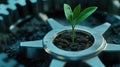 A green sprout grows from soil within a metallic gear, symbolizing eco-friendly innovation Royalty Free Stock Photo