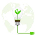 Green sprout in light bulb connected to electrical plug on blurred globe background, green energy environmental concept Royalty Free Stock Photo