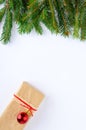 Green spruce branches, gift box on a white background. New Year, christmas background. Royalty Free Stock Photo