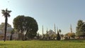 Green square with fountains near Sultan Ahmed Mosque Blue mosque in Istanbul, Turkey in a sunny day. 4K UHD video, 3840