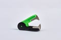 Green stapler remover isolated on white background.