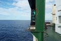 Green starboard side navigational lights of ship is situated next to superstructure.
