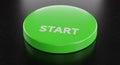 Green Start Button on Dark Surface Royalty Free Stock Photo