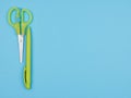 Green stationery on light blue background