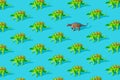 Green Stegosaurus and gray Ankylosaurus dinosaur toy on a blue background. Pattern Royalty Free Stock Photo