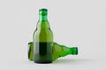 Green steinie beer bottle mockup on a grey background