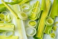 Green stems of cutted leeks on white background Royalty Free Stock Photo