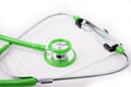 Green Stethoscope with plastic clipboard , blank paper