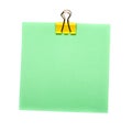 Green Stick Note with yellow paper clip holder isolated on white background. Mock up Royalty Free Stock Photo