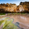 Green Stones at Porto de Mos Beach in Lagos, Algarve Royalty Free Stock Photo