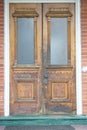 Antique wooden crafted door with windows.