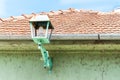 Green street lamp or lantern on the exterior wall facade of house to provide light at the night Royalty Free Stock Photo