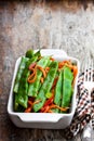 Green string beans and carrot with spices on wooden table Royalty Free Stock Photo