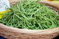 Green string beans in woven basket close-up Royalty Free Stock Photo