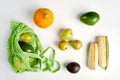 Green string eco shopping bag with vegatables avocado, corn, lemon and pumpkin Royalty Free Stock Photo