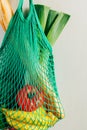 Green string shopping bag hanging on a hook in the kitchen Royalty Free Stock Photo