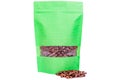 Green stripped paper doypack stand up pouch with window zipper filled with coffee beans on white background Royalty Free Stock Photo