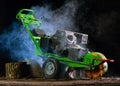 Green stump grinder for destroying trunks of fallen trees Royalty Free Stock Photo