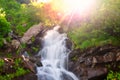 Green summer waterfall at sunny day Royalty Free Stock Photo
