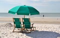 Green sun chairs and umbrella Royalty Free Stock Photo