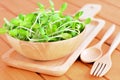Green sunflower sprout in the bowl on wooden table Royalty Free Stock Photo