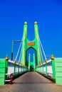 Green suspension bridge across Nan River at Chum Saeng District Royalty Free Stock Photo