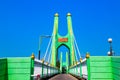 Green suspension bridge across Nan River at Chum Saeng District Royalty Free Stock Photo