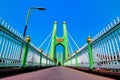 Green suspension bridge across Nan River at Chum Saeng District Royalty Free Stock Photo