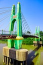 Green suspension bridge across Nan River at Chum Saeng District Royalty Free Stock Photo