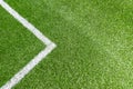 Green synthetic artificial grass soccer sports field with white corner stripe line Royalty Free Stock Photo