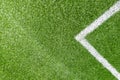 Green synthetic artificial grass soccer sports field with white corner stripe line Royalty Free Stock Photo
