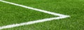 Green synthetic artificial grass soccer sports field with white corner stripe line Royalty Free Stock Photo