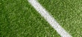 Green synthetic grass soccer sports field with white corner stripe line Royalty Free Stock Photo