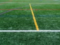 Green synthetic grass sports field with colorful lines Royalty Free Stock Photo