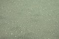 Green table surface with water drops Royalty Free Stock Photo