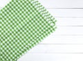 Green tablecloth on white wood table Royalty Free Stock Photo