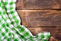 Green tablecloth on wooden table Royalty Free Stock Photo