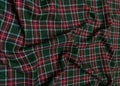 Green tartan woolen school uniform fabric material. Scottish classic seamless flannel cloth. Traditional wave pattern Royalty Free Stock Photo