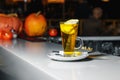 Green tea with apple slices in a glass cup on a white bar counter Royalty Free Stock Photo